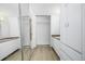 Bright bathroom featuring a mirrored closet, vanity with storage, and modern wood-look flooring for a clean aesthetic at 1196 N Grant St # 705, Denver, CO 80203