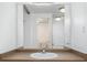 The bathroom features a vanity with a mirror, storage cabinets, and a partial view of the toilet, creating a practical space at 1196 N Grant St # 705, Denver, CO 80203