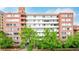 This attractive brick apartment building features large windows and mature trees in a desirable urban location at 1196 N Grant St # 705, Denver, CO 80203