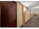 The hallway outside unit 705 features neutral wall colors, carpet, and sconce lighting at 1196 N Grant St # 705, Denver, CO 80203