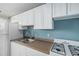 This kitchen offers ample storage with white cabinets and includes essential appliances for convenient meal preparation at 1196 N Grant St # 705, Denver, CO 80203