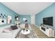 Modern living space with sofa and full bed, bathed in light from expansive windows at 1196 N Grant St # 705, Denver, CO 80203