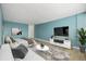 Cozy living area with hardwood floors, modern TV setup, and stylish furnishings at 1196 N Grant St # 705, Denver, CO 80203