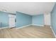 The living room has hardwood floors and blue walls at 1196 N Grant St # 705, Denver, CO 80203