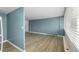 The living room has hardwood floors and blue walls at 1196 N Grant St # 705, Denver, CO 80203