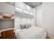 Efficiently designed bedroom with built-in storage, desk, and a comfortable bed, maximizing space in style at 891 14Th St # 2703, Denver, CO 80202