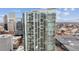 High-rise with expansive glass windows showcasing stunning urban vistas, offering modern living at 891 14Th St # 2703, Denver, CO 80202