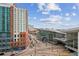 City street view with modern buildings and the famous blue bear, showcasing the vibrant urban location at 891 14Th St # 2703, Denver, CO 80202