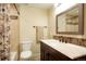 Bathroom featuring a decorative vanity, toilet and shower at 6840 Northstar Cir, Castle Rock, CO 80108