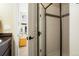 Bright bathroom featuring neutral tones and a shower with tile walls at 6840 Northstar Cir, Castle Rock, CO 80108