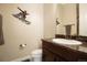 Bathroom featuring neutral tones and a vanity with granite countertops at 6840 Northstar Cir, Castle Rock, CO 80108