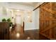 Elegant foyer featuring hardwood floors, a barn door accent, and ample natural light at 6840 Northstar Cir, Castle Rock, CO 80108