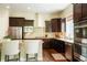 Stylish kitchen featuring a breakfast bar, stainless steel appliances, and ample cabinet space at 6840 Northstar Cir, Castle Rock, CO 80108