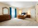 Spacious bedroom featuring a queen-sized bed and matching furniture at 6840 Northstar Cir, Castle Rock, CO 80108