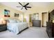 Spacious main bedroom featuring neutral tones, plush carpeting, and ensuite bathroom access at 6840 Northstar Cir, Castle Rock, CO 80108
