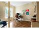 Inviting home office featuring wood floors, large windows, and a comfortable workspace at 6840 Northstar Cir, Castle Rock, CO 80108