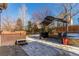 Backyard with gazebo, hot tub, and stone retaining wall at 4460 S Himalaya Ct, Aurora, CO 80015