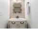 Small bathroom with a vanity and decorative tile at 4460 S Himalaya Ct, Aurora, CO 80015