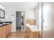 Elegant bathroom with double vanity and a soaking tub at 4460 S Himalaya Ct, Aurora, CO 80015