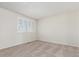 Spacious bedroom with neutral carpeting and window shutters at 4460 S Himalaya Ct, Aurora, CO 80015