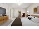 Relaxing main bedroom with a comfy bed and large mirror at 4460 S Himalaya Ct, Aurora, CO 80015