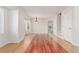 Formal dining area with hardwood floors and access to the living room and kitchen at 4460 S Himalaya Ct, Aurora, CO 80015