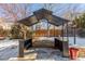 Backyard gazebo with seating area and partial snow cover at 4460 S Himalaya Ct, Aurora, CO 80015