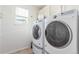 Laundry room with washer and dryer, and a window at 4460 S Himalaya Ct, Aurora, CO 80015