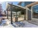 Covered patio with pergola, string lights, and backyard access at 4460 S Himalaya Ct, Aurora, CO 80015