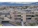 Aerial view of the townhomes and landscape including a drive under parking area at 2938 Kalmia Ave # 27, Boulder, CO 80301