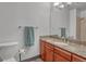 Bathroom with granite countertop vanity, cherry cabinets, and tile shower at 2938 Kalmia Ave # 27, Boulder, CO 80301