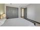 View of bedroom featuring neutral walls, grey doors, wood furniture, and grey carpet at 2938 Kalmia Ave # 27, Boulder, CO 80301