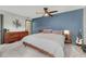 Spacious carpeted bedroom with a statement wall, and wood furniture at 2938 Kalmia Ave # 27, Boulder, CO 80301