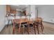 Open concept dining room with view into kitchen with laminate floors, modern wooden furniture at 2938 Kalmia Ave # 27, Boulder, CO 80301