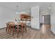 Open concept dining room with view into kitchen with modern wooden furniture and flooring at 2938 Kalmia Ave # 27, Boulder, CO 80301