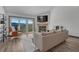 Bright living room featuring a fireplace, large sliding glass doors and laminate floors at 2938 Kalmia Ave # 27, Boulder, CO 80301