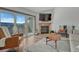 Bright living room featuring a fireplace, large sliding glass doors and laminate floors at 2938 Kalmia Ave # 27, Boulder, CO 80301