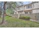 Fenced backyard with mature landscaping and green grass at 3033 W 107Th Pl # D, Westminster, CO 80031