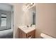 Bright bathroom featuring modern fixtures, white tile and wood vanity at 3033 W 107Th Pl # D, Westminster, CO 80031