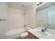 Bright bathroom featuring a shower-tub combo, white tile and vanity with modern fixtures at 3033 W 107Th Pl # D, Westminster, CO 80031
