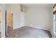 Bright bedroom featuring neutral walls, plush carpet, and a view into hallway and staircase at 3033 W 107Th Pl # D, Westminster, CO 80031