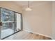 Bright dining area featuring wood floors, sliding glass door to patio, and modern pendant lighting at 3033 W 107Th Pl # D, Westminster, CO 80031