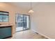 Kitchen with stainless steel sink, sliding door, and modern appliances and fixtures at 3033 W 107Th Pl # D, Westminster, CO 80031