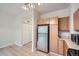 Kitchen with stainless steel appliances, ample counter space, and light wood cabinets at 3033 W 107Th Pl # D, Westminster, CO 80031