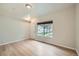 Bright living room with a large window and hardwood floors at 3033 W 107Th Pl # D, Westminster, CO 80031