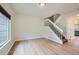 Bright living room boasts hardwood floors and a staircase leading to the upper level at 3033 W 107Th Pl # D, Westminster, CO 80031