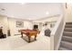 Spacious finished basement featuring pool table, stairs and rec area at 5344 E Otero Dr, Centennial, CO 80122