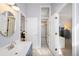Bright bathroom featuring vanity, tiled floors, shower and neutral paint at 5344 E Otero Dr, Centennial, CO 80122
