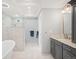 Bright bathroom with a walk-in shower, soaking tub, and modern fixtures at 5344 E Otero Dr, Centennial, CO 80122