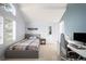 Bedroom with sloped ceiling, gray accent wall, shutters, and desk at 5344 E Otero Dr, Centennial, CO 80122
